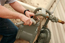 Plumber with wrench and pipe